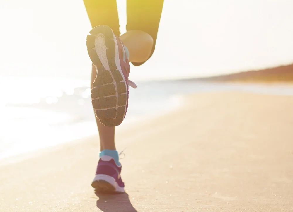  a lady chiropractor jogging near by the beach